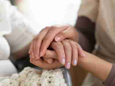 Hands clasped during social rehabilitation