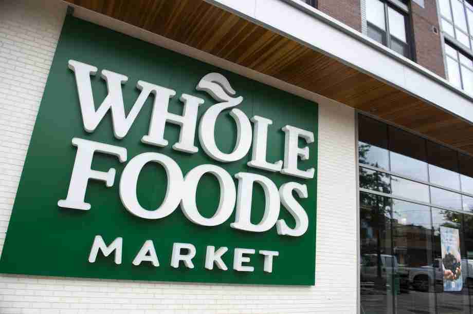 FILE-- A Whole Foods Market sign is seen in Washington, DC. A second wave of strikes are expected to hit Friday as essential workers from Whole Foods, Amazon and other large corporations demand better protections amid the pandemic. Photo: SAUL LOEB/AFP/Getty Images